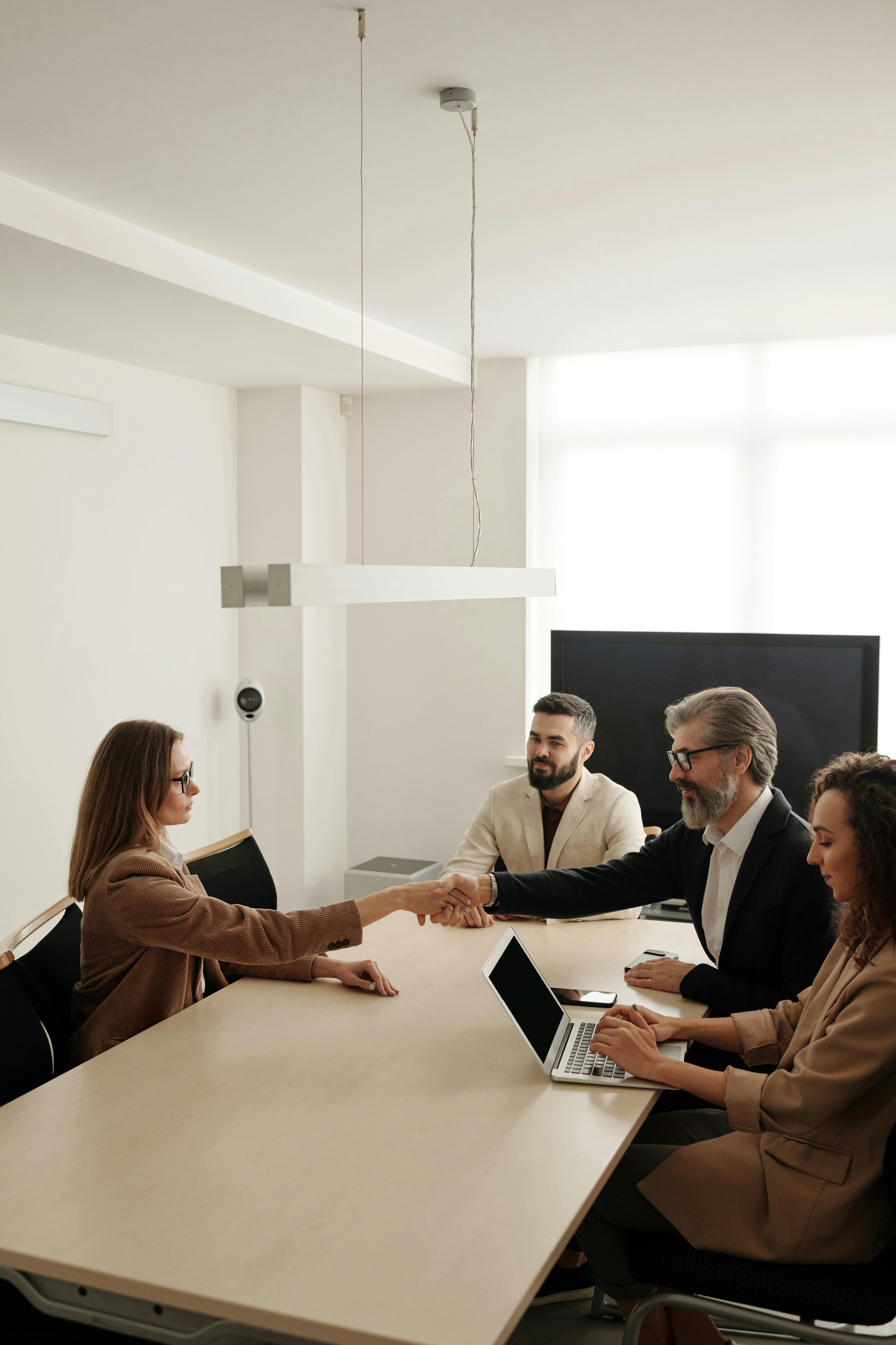 Professional handshake representing partnership in community security